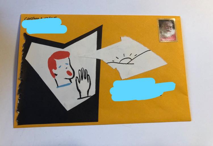 photo of a collage on an orange envelope