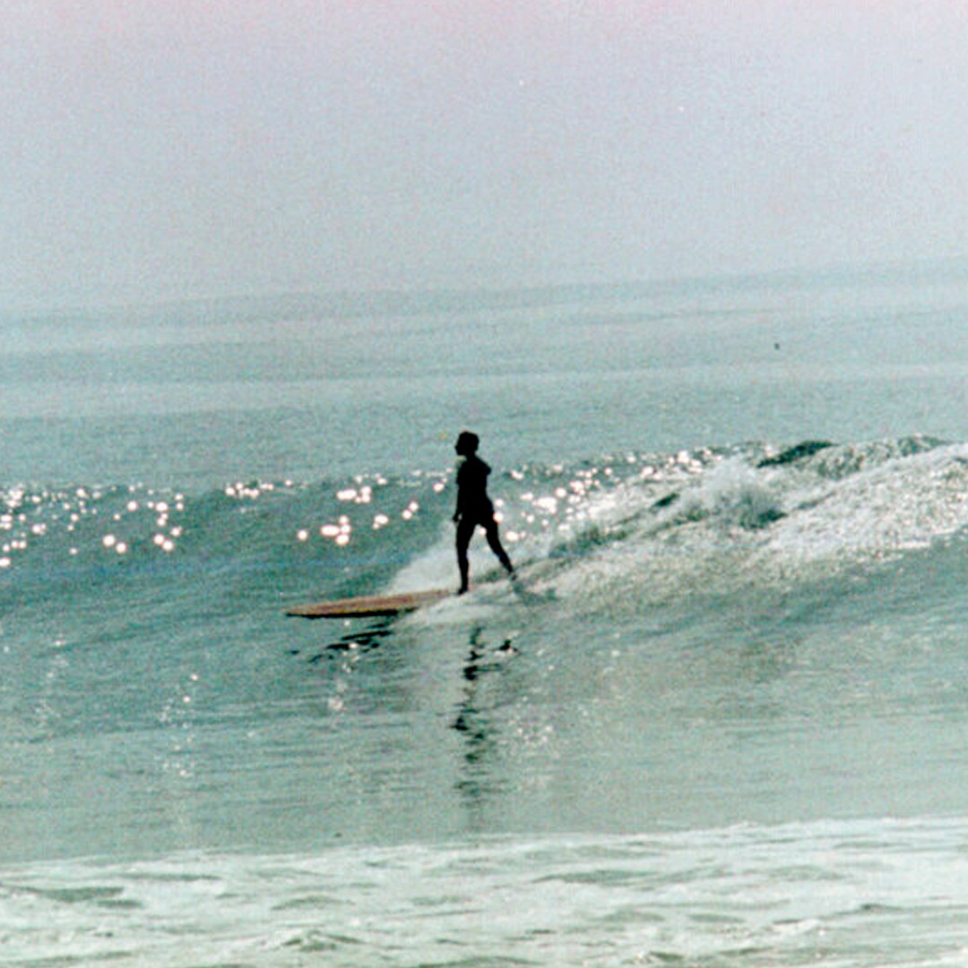 Vintage photo of woman surfer